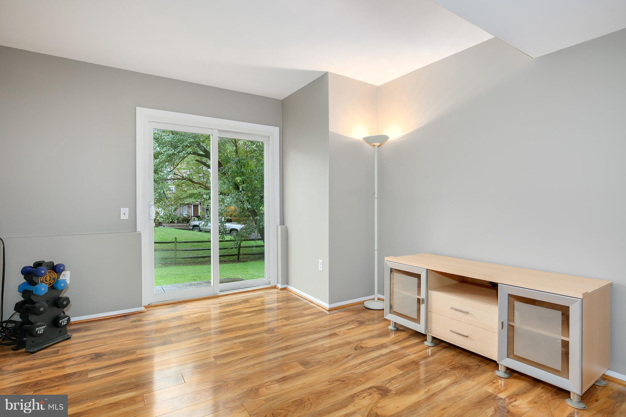 100 Applecreek Road Frederick, MD 21702 - Photo 11 of 30 a view of empty room with wooden floor and fan