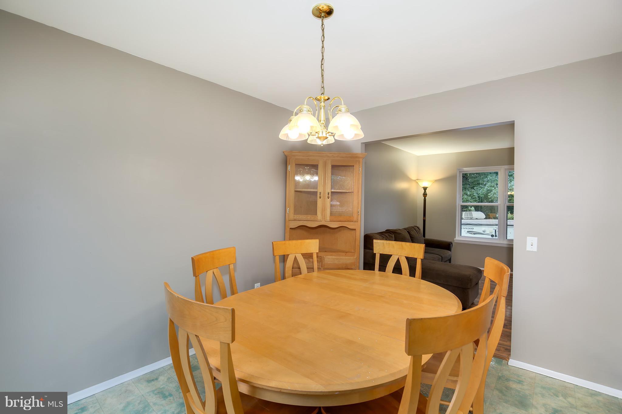 100 Applecreek Road Frederick, MD 21702 - Photo 12 of 30 a dining room with furniture and window