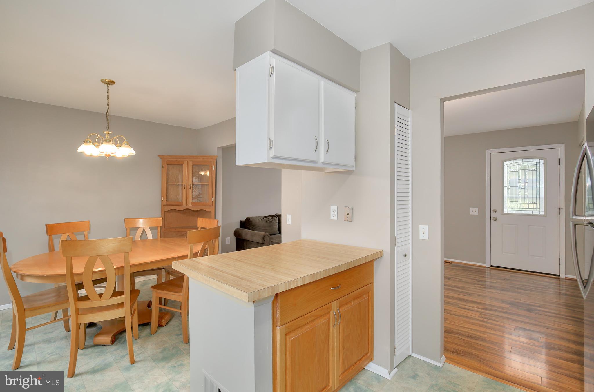 100 Applecreek Road Frederick, MD 21702 - Photo 15 of 30 a view of a kitchen counter space and wooden floor