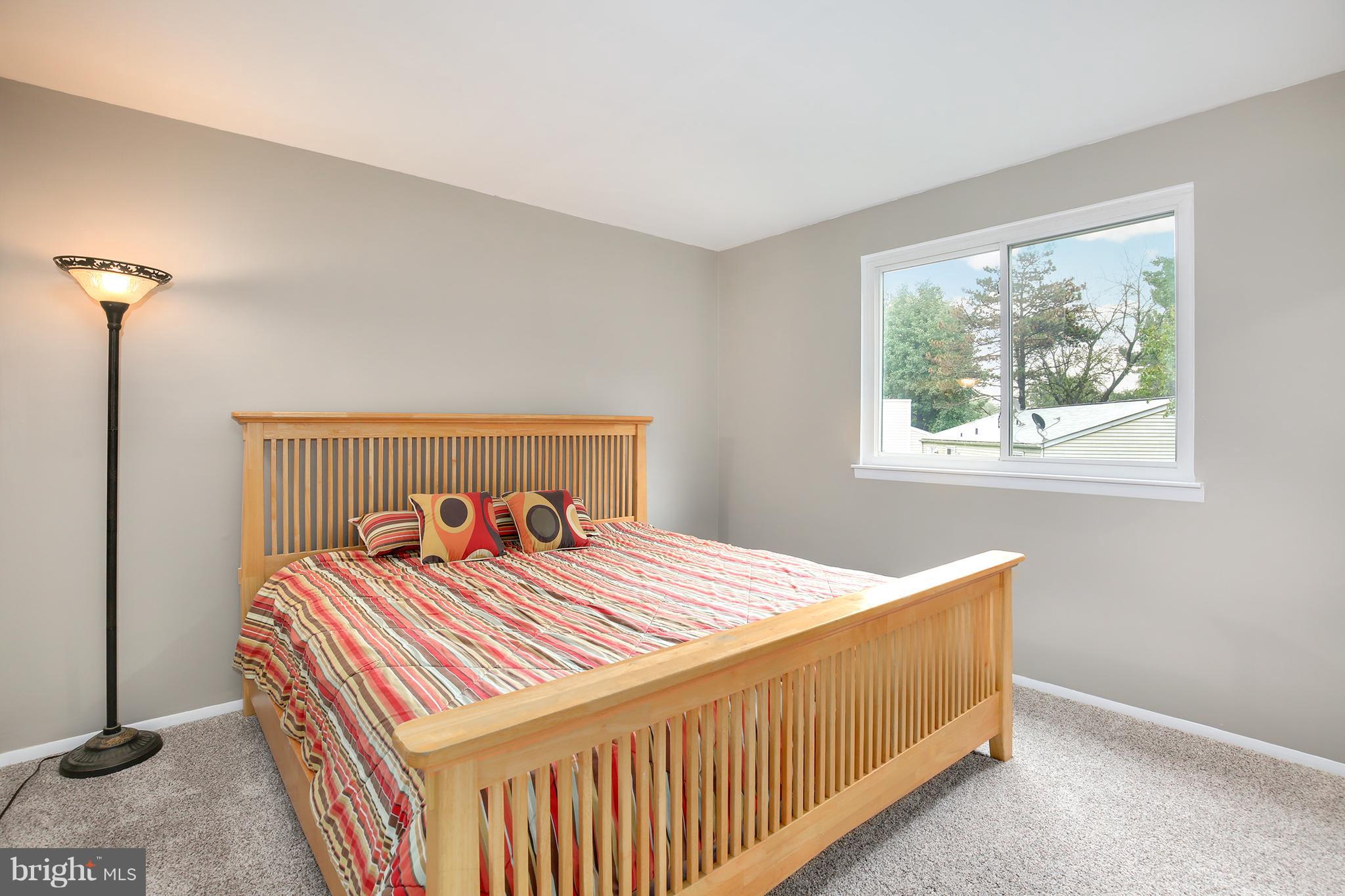 100 Applecreek Road Frederick, MD 21702 - Photo 19 of 30 a bedroom with a bed and a window