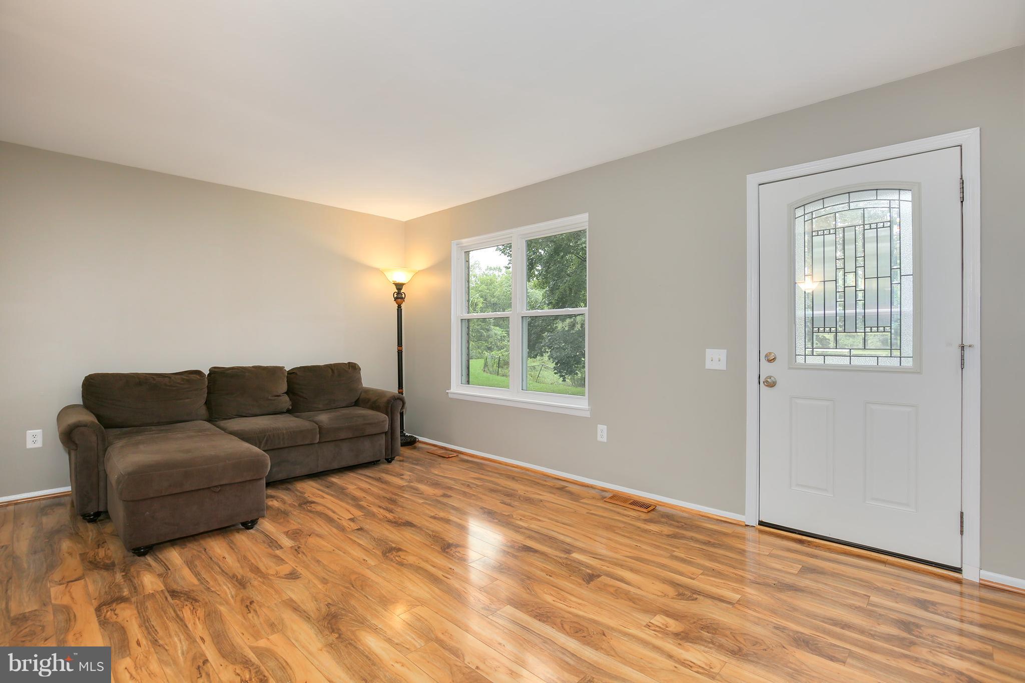 100 Applecreek Road Frederick, MD 21702 - Photo 3 of 30 a living room with furniture and a window
