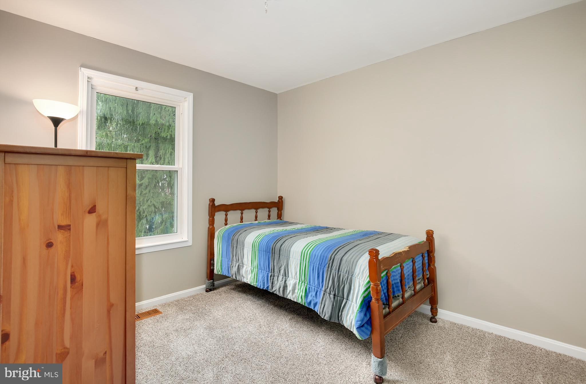 100 Applecreek Road Frederick, MD 21702 - Photo 21 of 30 a bedroom with a bed and a window