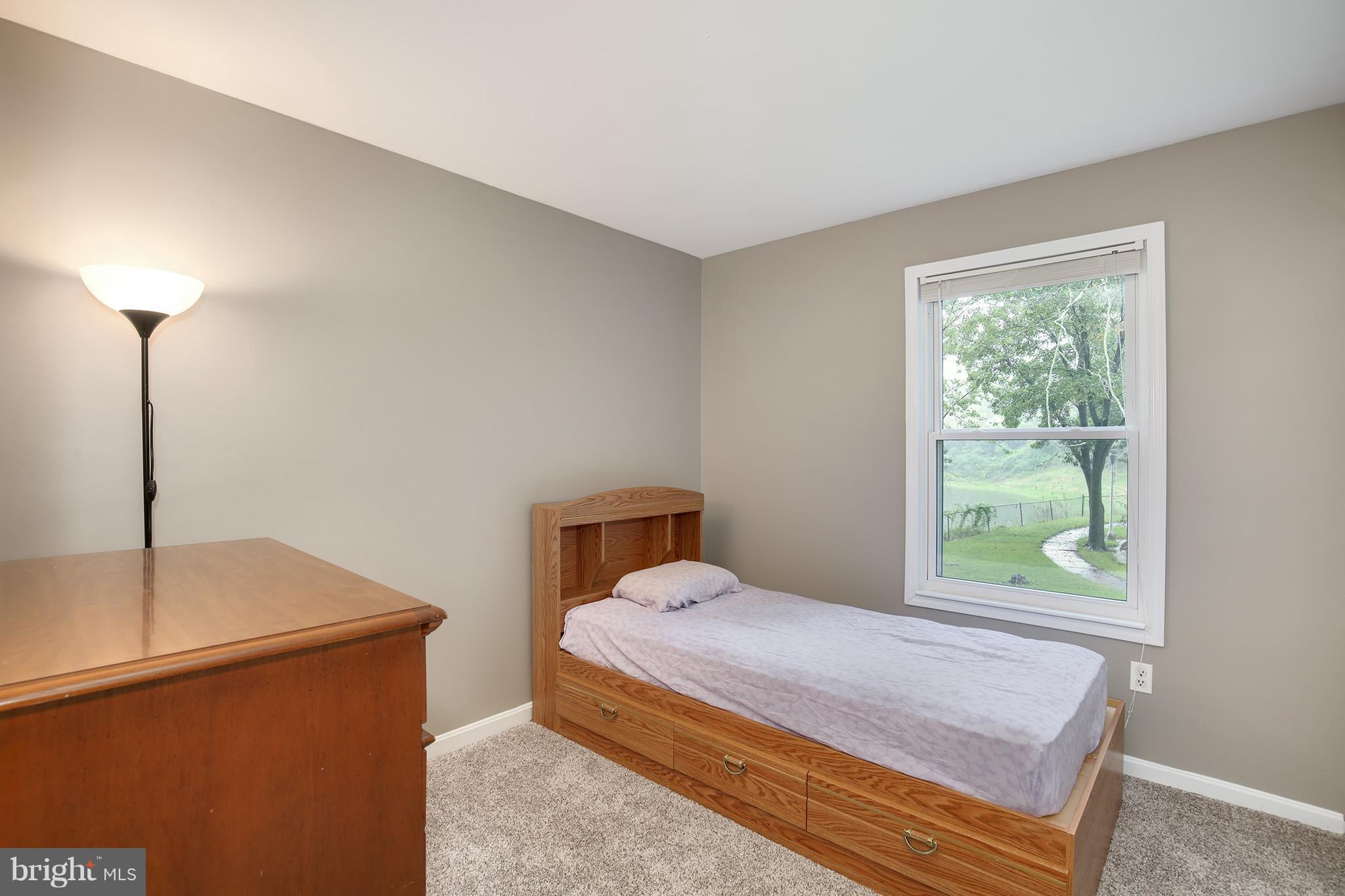 100 Applecreek Road Frederick, MD 21702 - Photo 22 of 30 a bedroom with a bed and a window