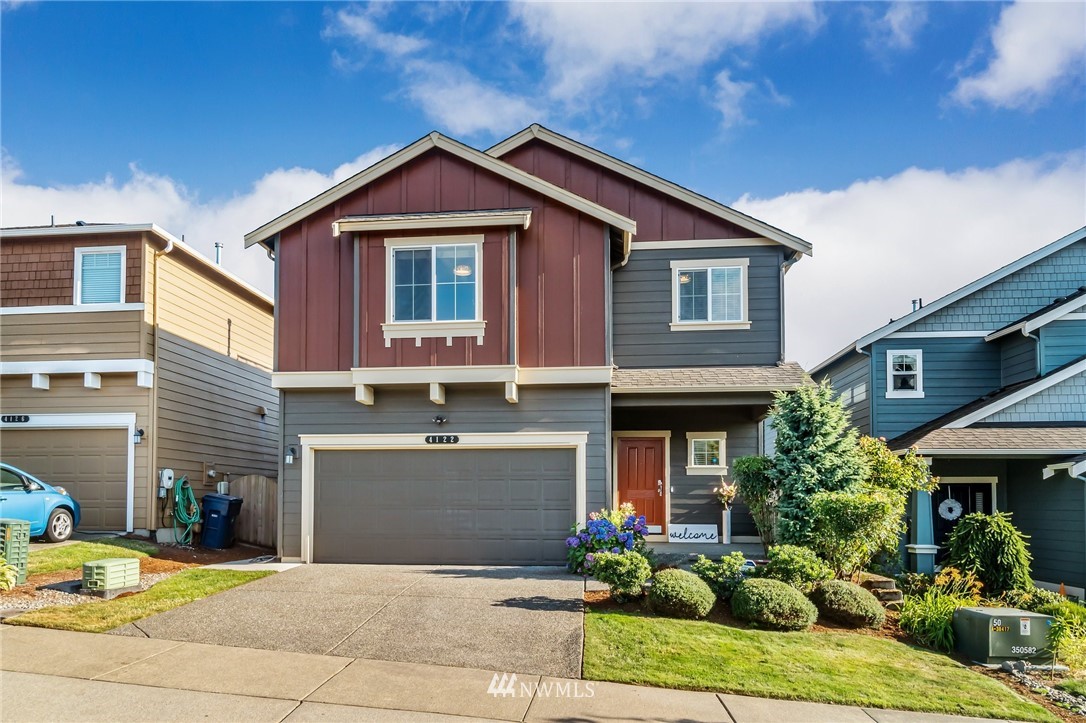 4122 167th Place Southeast Bothell, WA 98012 - Photo 1 of 40 a front view of a house with garden
