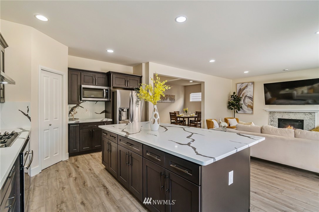 4122 167th Place Southeast Bothell, WA 98012 - Photo 15 of 40 a kitchen with a sink stove and refrigerator