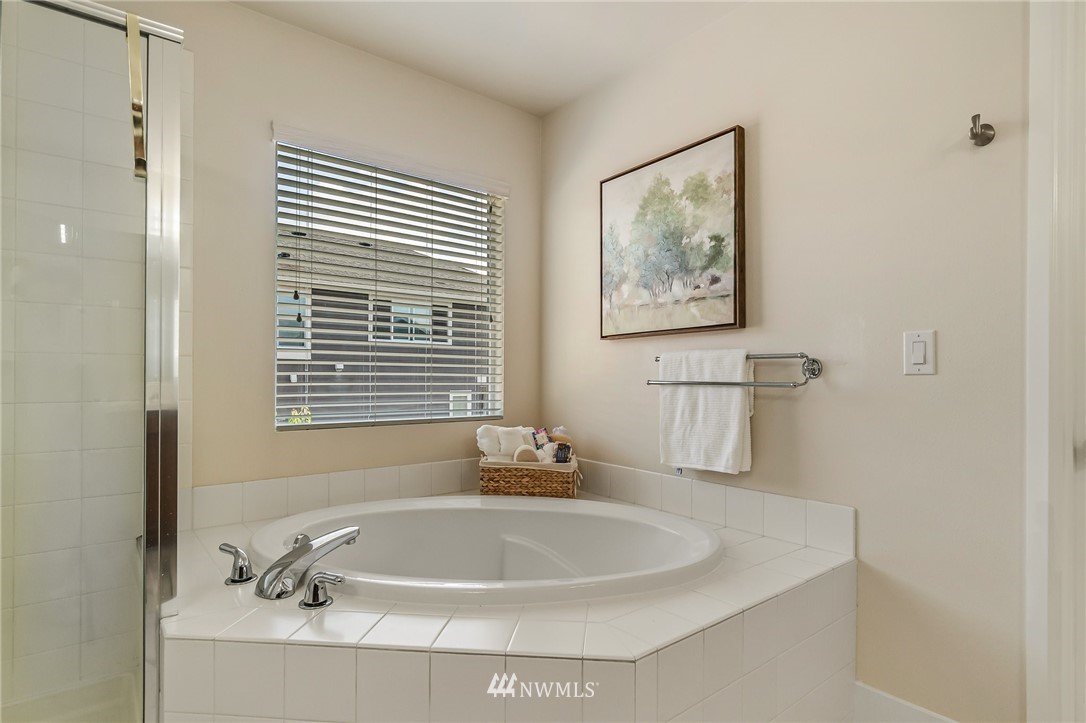 4122 167th Place Southeast Bothell, WA 98012 - Photo 29 of 40 a white bath tub sitting next to a white sink