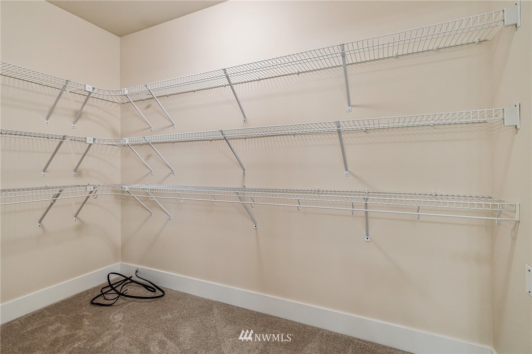 4122 167th Place Southeast Bothell, WA 98012 - Photo 30 of 40 a view of a room with racks on the wall