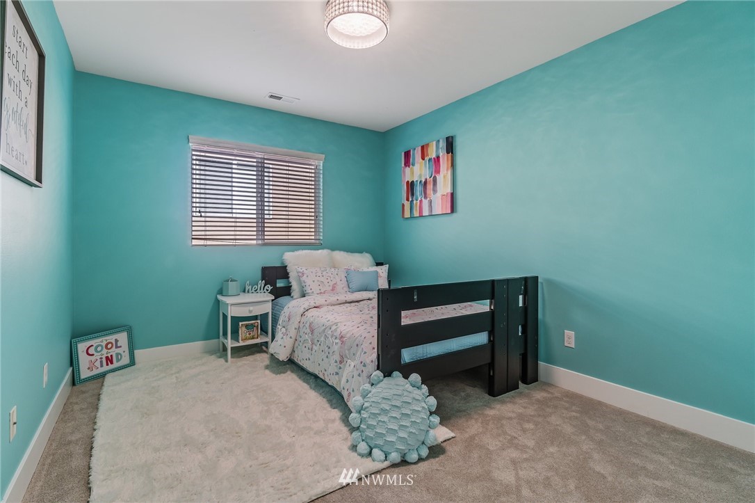 4122 167th Place Southeast Bothell, WA 98012 - Photo 33 of 40 a bedroom with a bed and a window