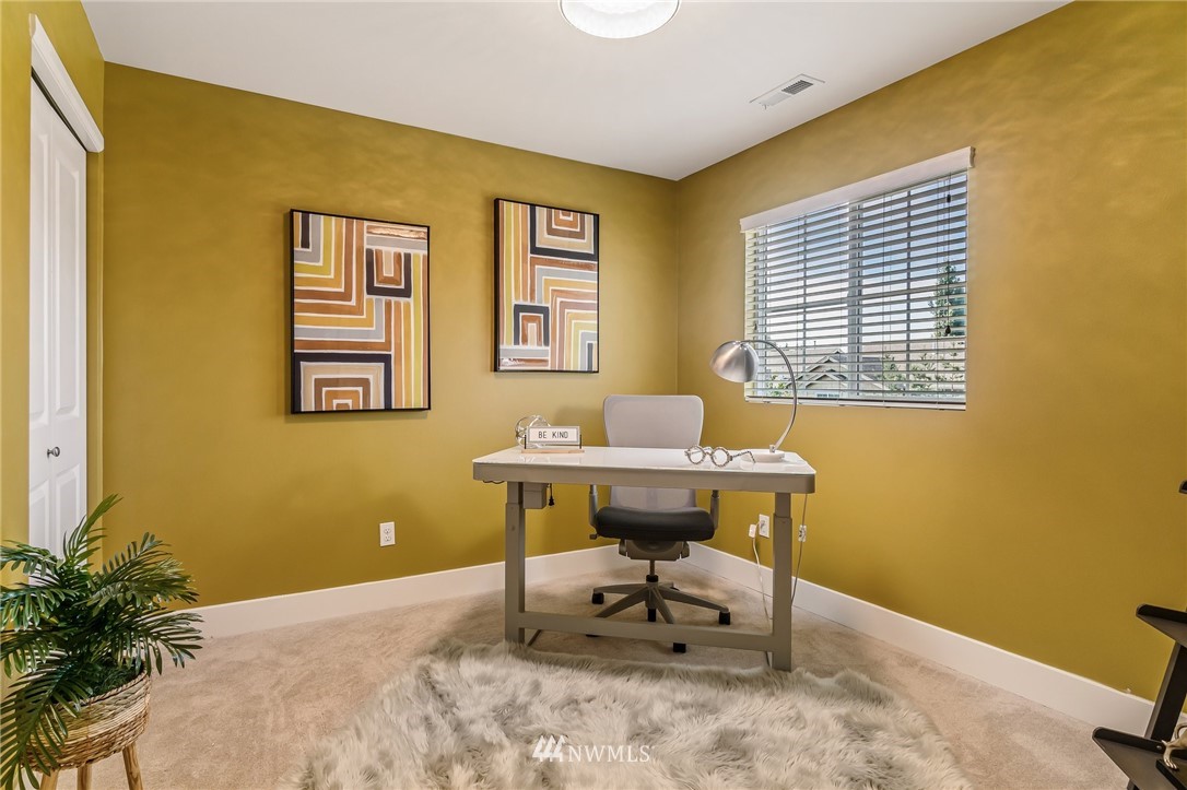 4122 167th Place Southeast Bothell, WA 98012 - Photo 36 of 40 a view of a workspace with furniture and a window