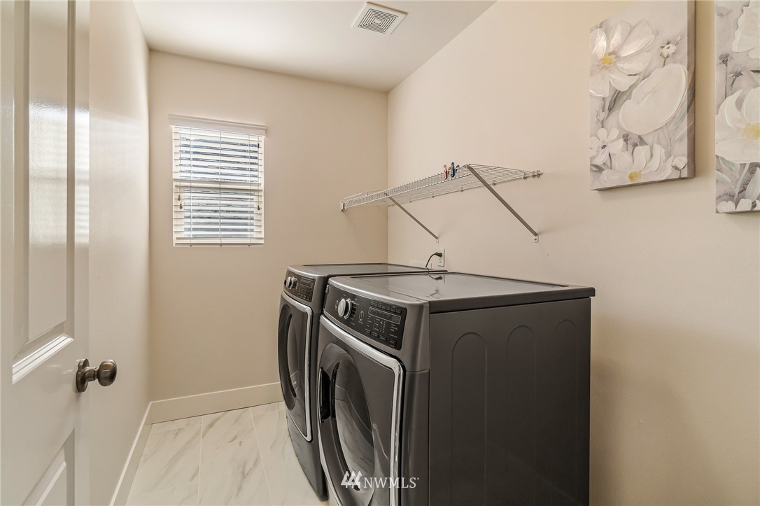 4122 167th Place Southeast Bothell, WA 98012 - Photo 37 of 40 a utility room with dryer and washer