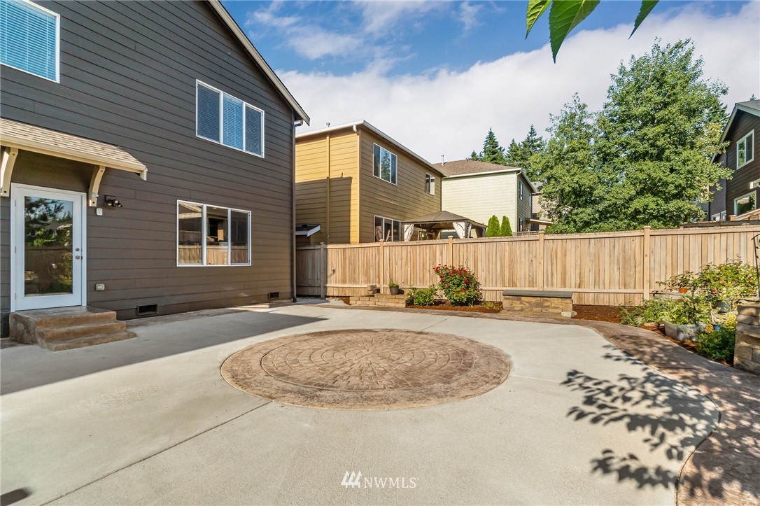 4122 167th Place Southeast Bothell, WA 98012 - Photo 39 of 40 a view of a house with a yard and wooden fence