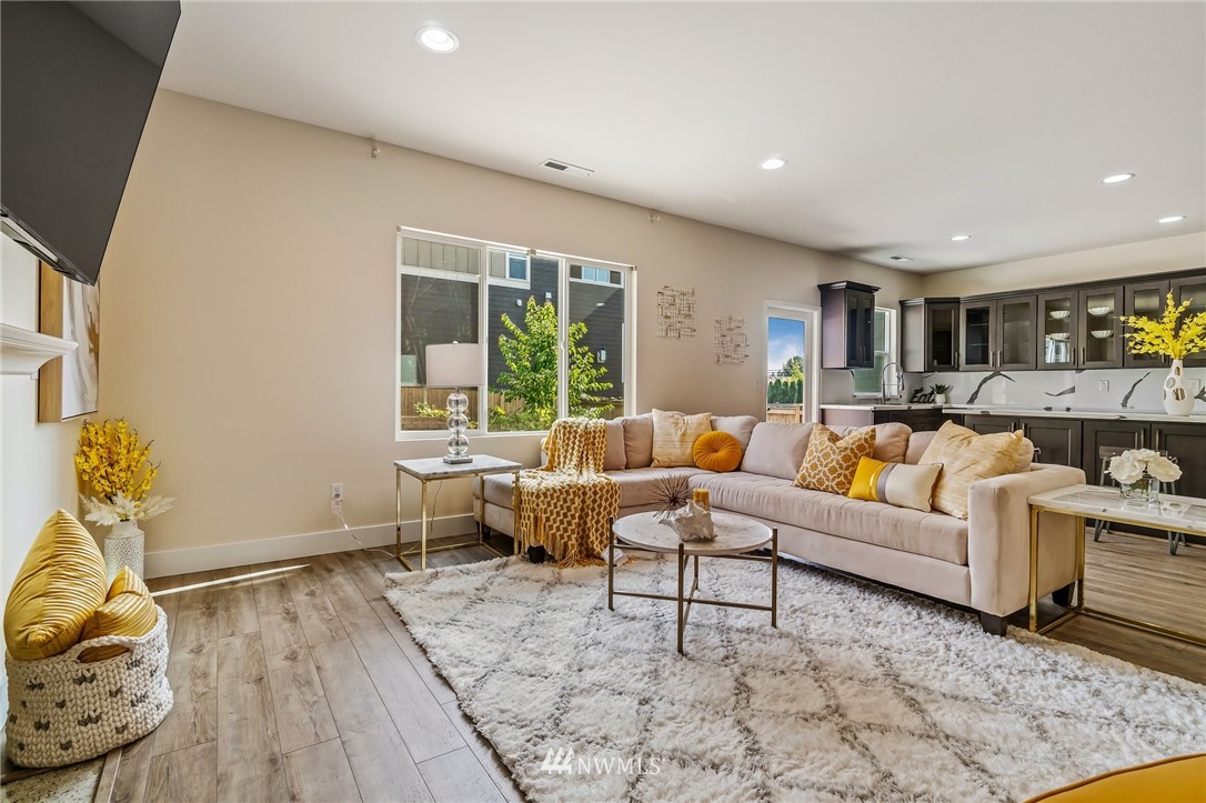 4122 167th Place Southeast Bothell, WA 98012 - Photo 6 of 40 a living room with furniture and a wooden floor