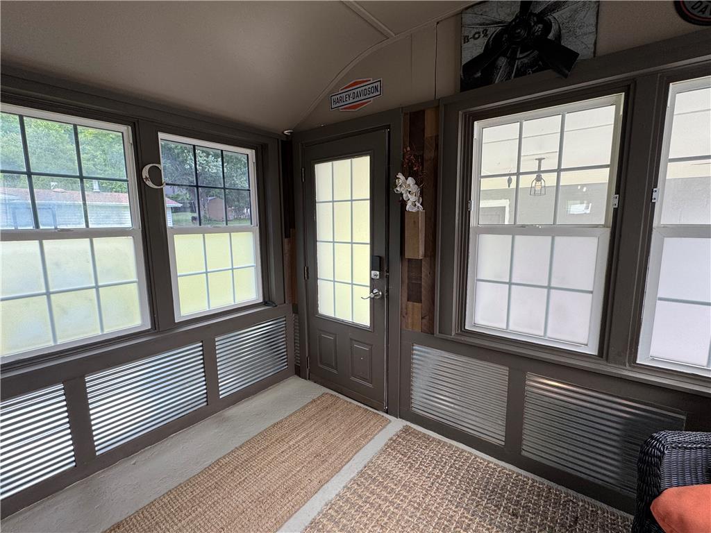 4425 Vera Cruz Road Center Valley, PA 18034 - Photo 10 of 17 A well-lit sunroom with ample windows, offering a versatile space for relaxation.