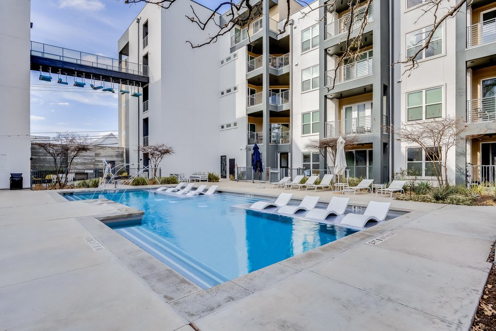 4801 Springdale Road, Unit 2107 Austin, TX 78723 - Photo 2 of 26 a view of tall buildings with a outdoor space