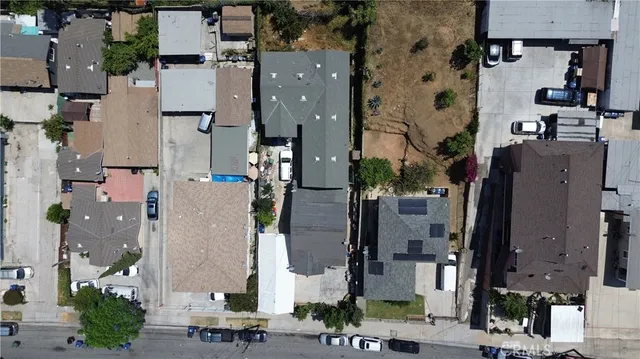 an aerial view of residential houses with outdoor space