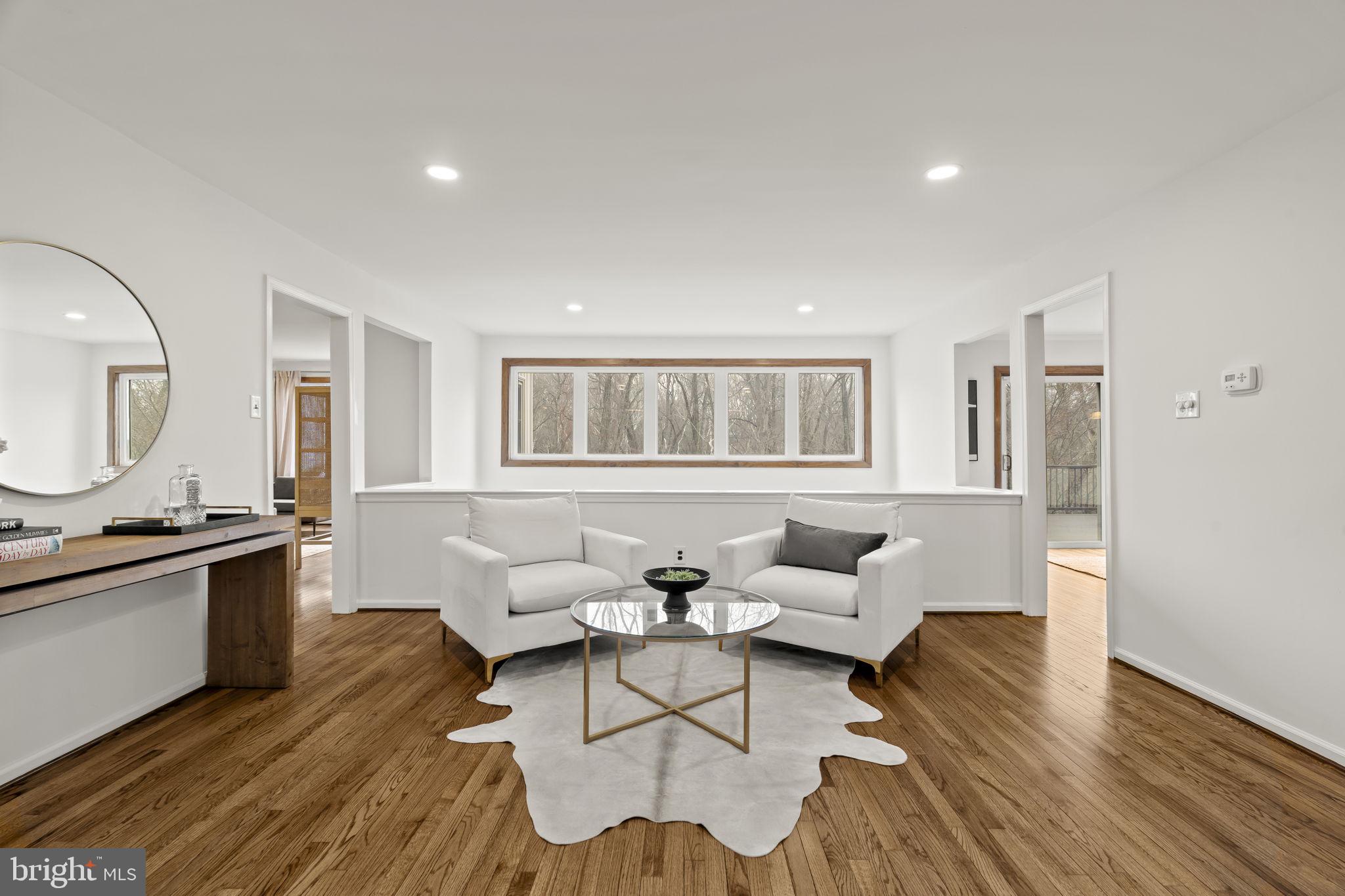 49 Langstoon Lane Media, PA 19063 - Photo 2 of 64 a living room with furniture or couch and a wooden floor