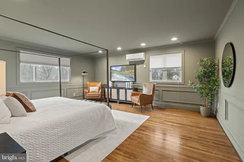 a bedroom with furniture and a window