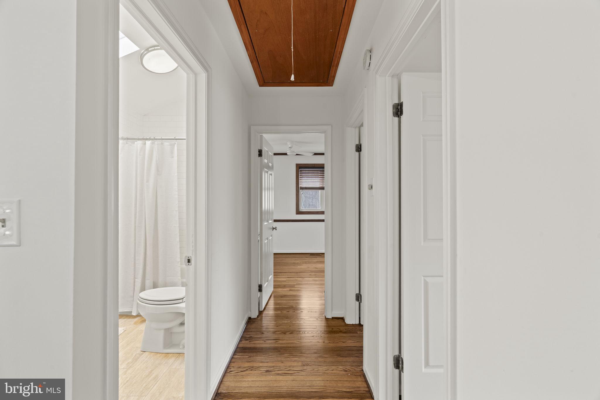 49 Langstoon Lane Media, PA 19063 - Photo 33 of 64 a view of a hallway with wooden floor and staircase