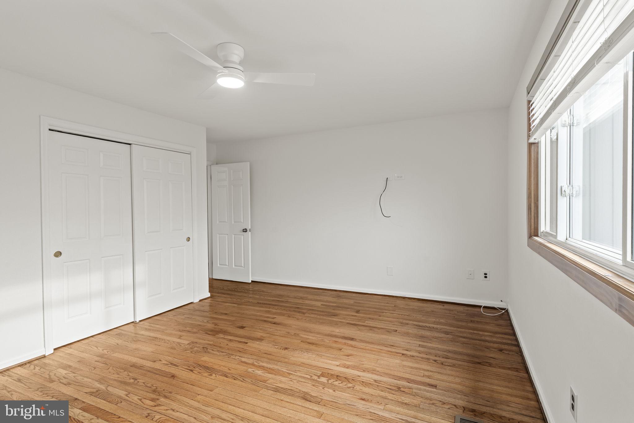49 Langstoon Lane Media, PA 19063 - Photo 34 of 64 a view of an empty room with wooden floor and a window