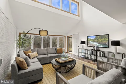 swimming pool view with a sitting space