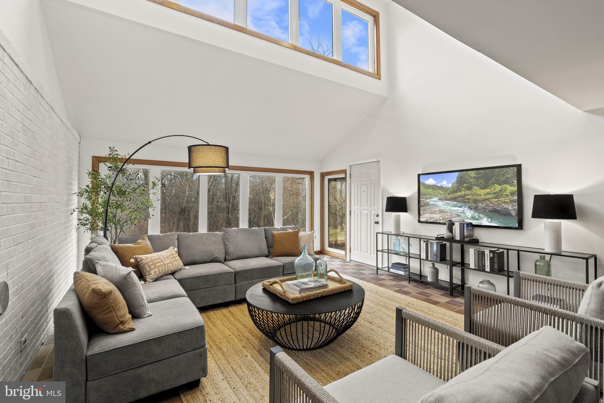 49 Langstoon Lane Media, PA 19063 - Photo 44 of 64 a living room with furniture and a flat screen tv