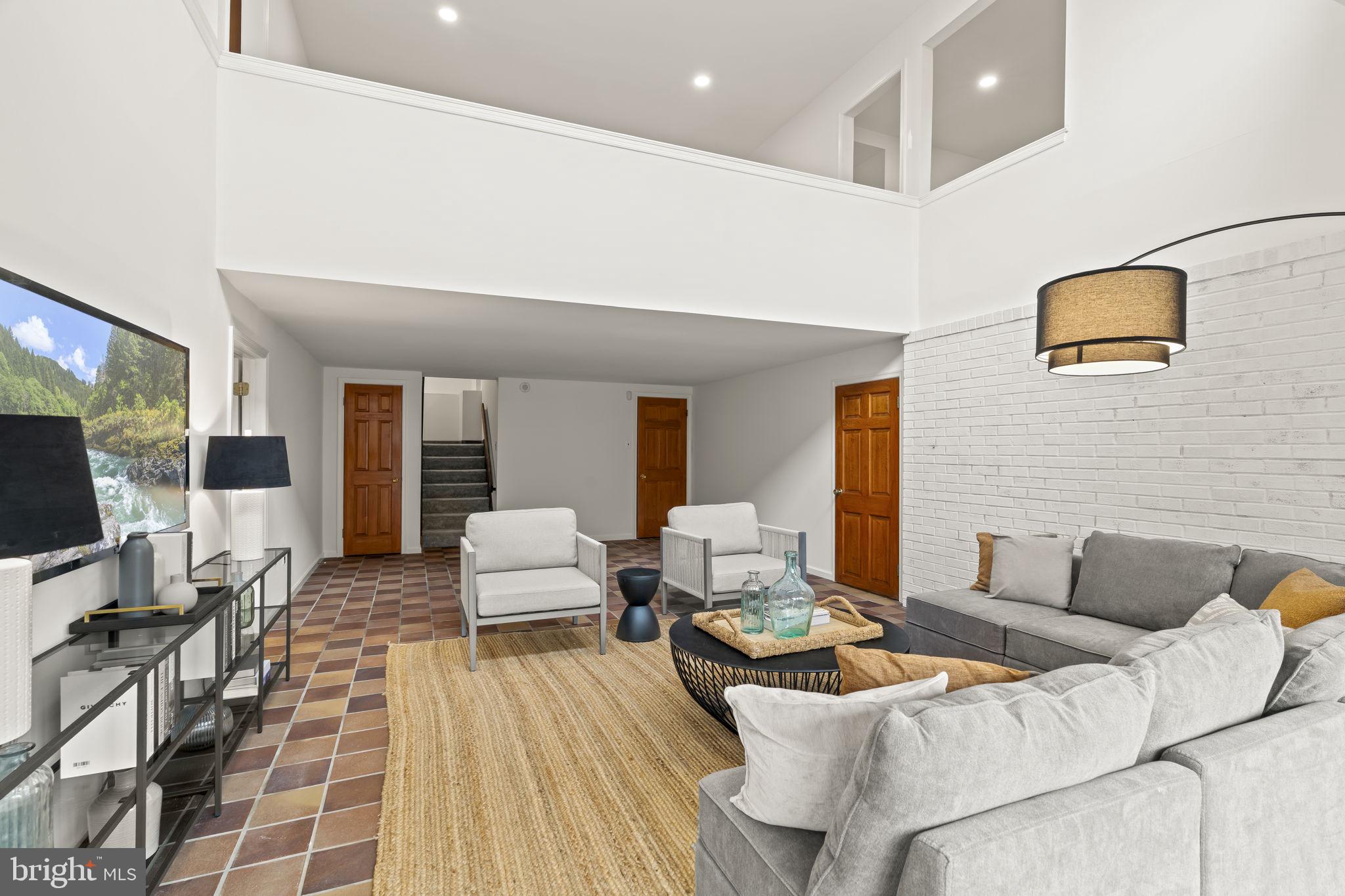 49 Langstoon Lane Media, PA 19063 - Photo 46 of 64 a living room with furniture and a flat screen tv