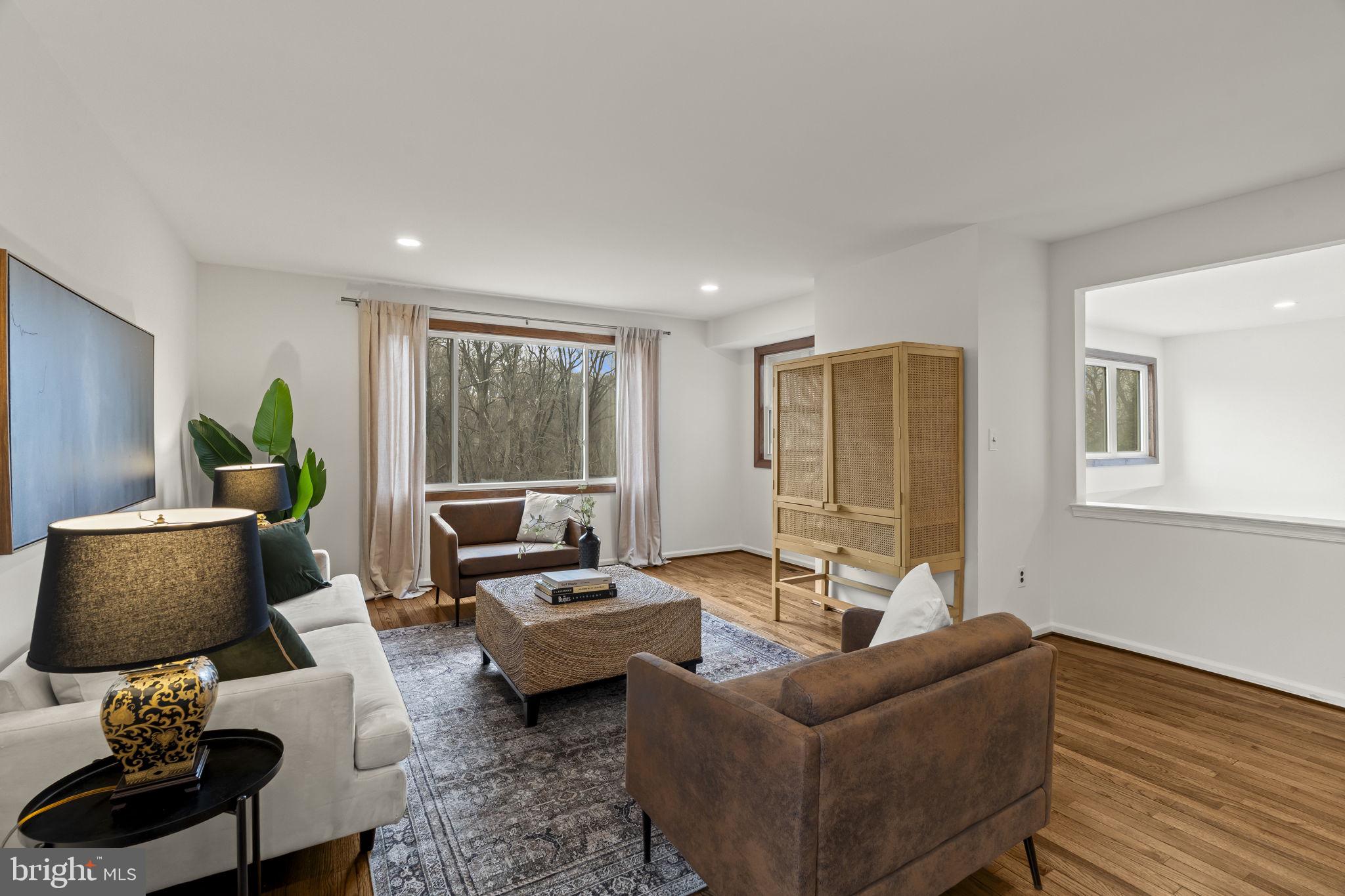 49 Langstoon Lane Media, PA 19063 - Photo 5 of 64 a living room with furniture and a large window