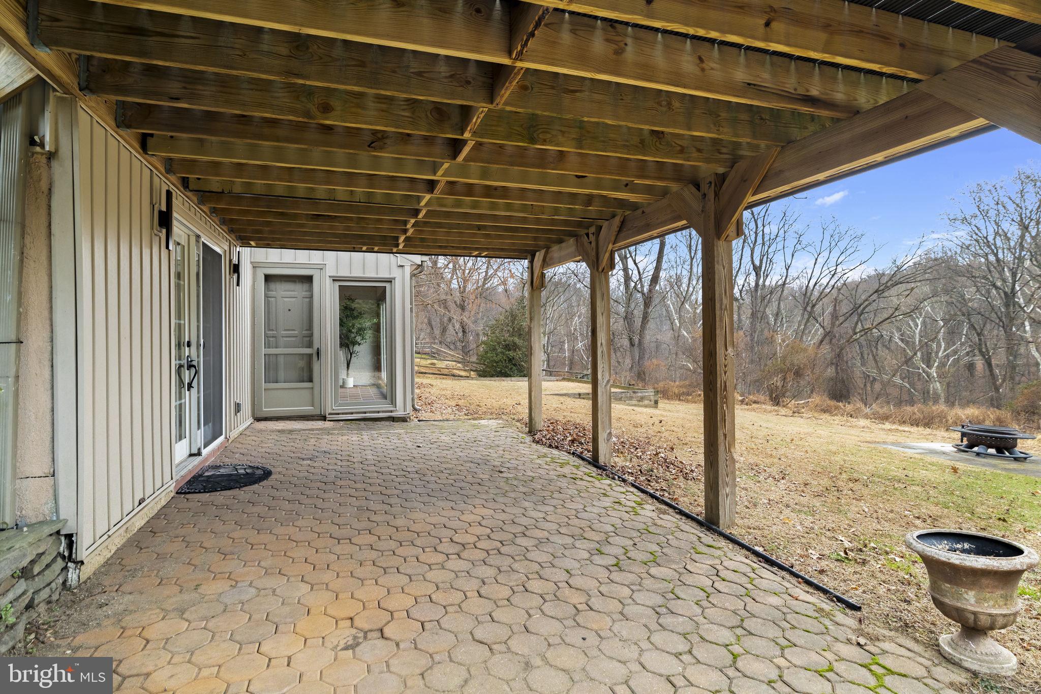 49 Langstoon Lane Media, PA 19063 - Photo 53 of 64 a view of a porch with a wooden fence and floor