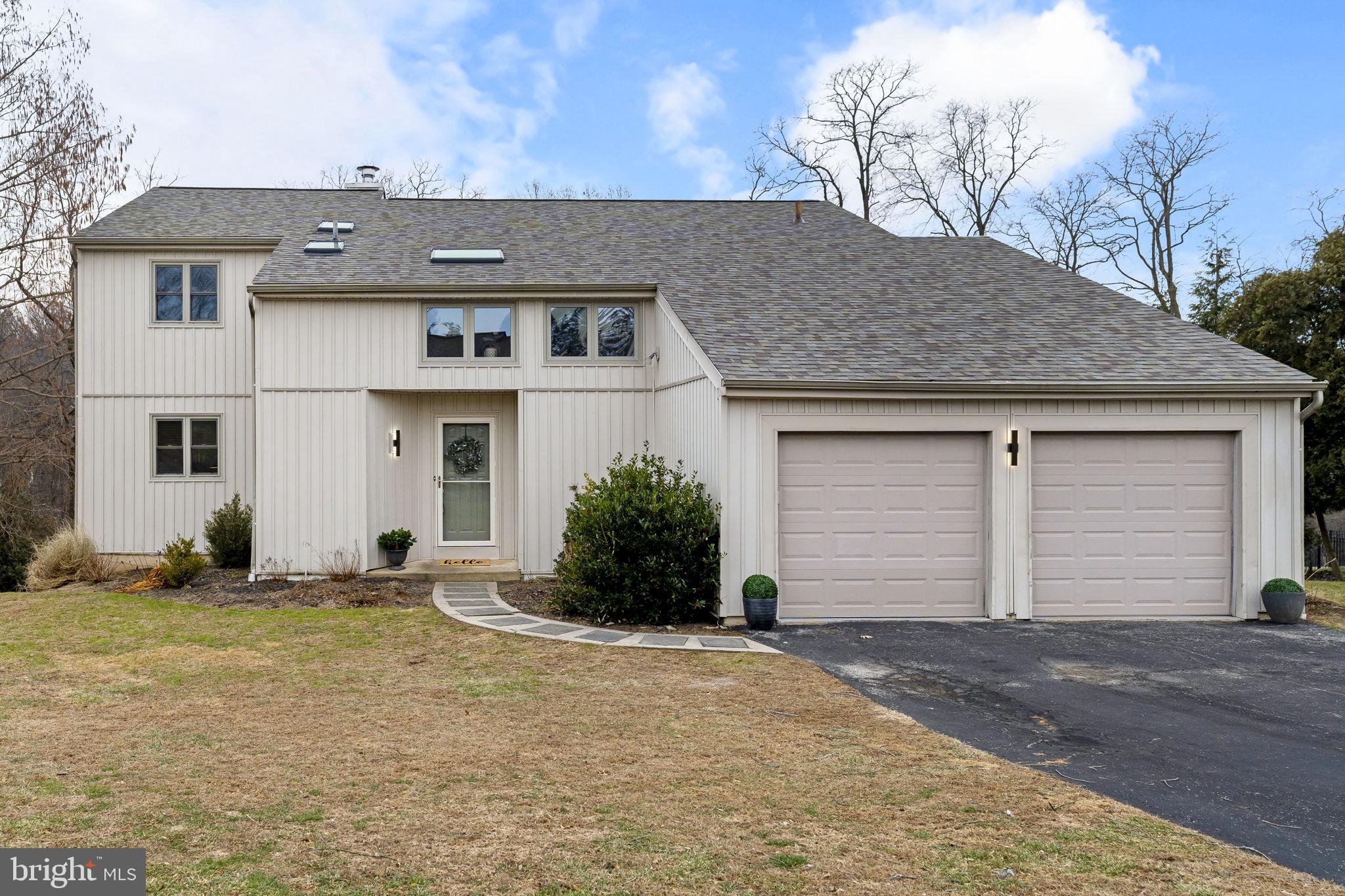 49 Langstoon Lane Media, PA 19063 - Photo 8 of 64 a front view of a house with a yard