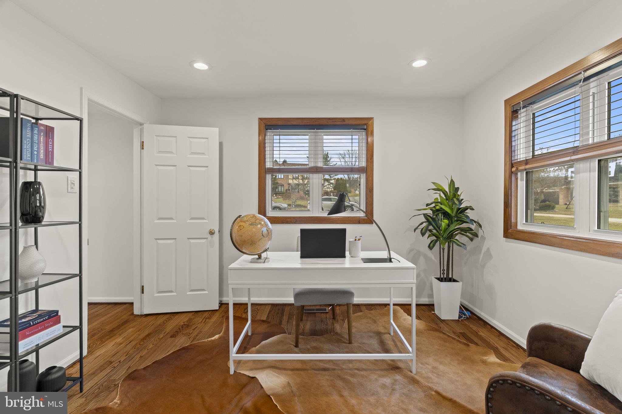 49 Langstoon Lane Media, PA 19063 - Photo 10 of 64 a living room with furniture a chandelier and a floor to ceiling window