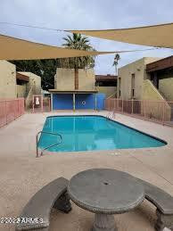 1701 West Tuckey Lane, Unit 225 Phoenix, AZ 85015 - Photo 2 of 13 a view of a living room and kitchen space