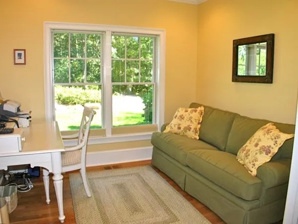 a living room with couch and a table