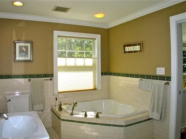 a bath tub sitting next to a white sink