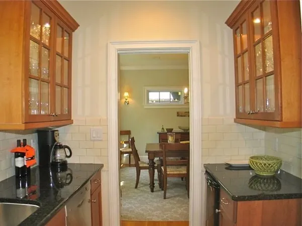 a kitchen with stainless steel appliances granite countertop a sink and cabinets