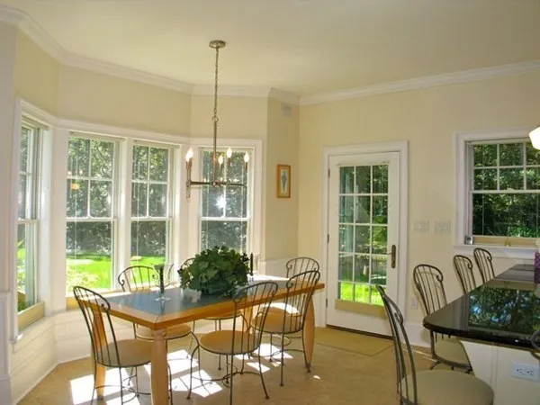 a view of a dining room with furniture window and outside view