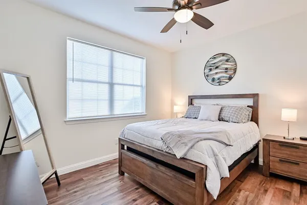 a bedroom with a bed and a window