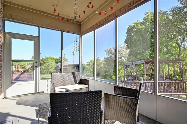 a view of a brick building next to a lake