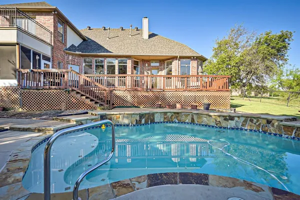 an aerial view of a house with swimming pool