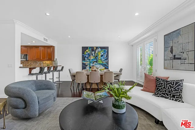 a living room with furniture flowerpot and a potted plant