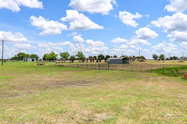 a view of a house with a yard porch and sitting area