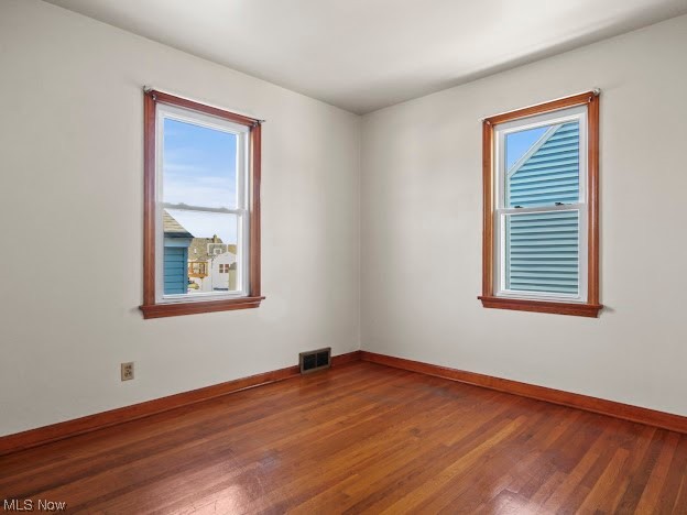 253 Wilson Street Struthers, OH 44471 - Photo 8 of 12 Empty room featuring dark hardwood / wood-style floors