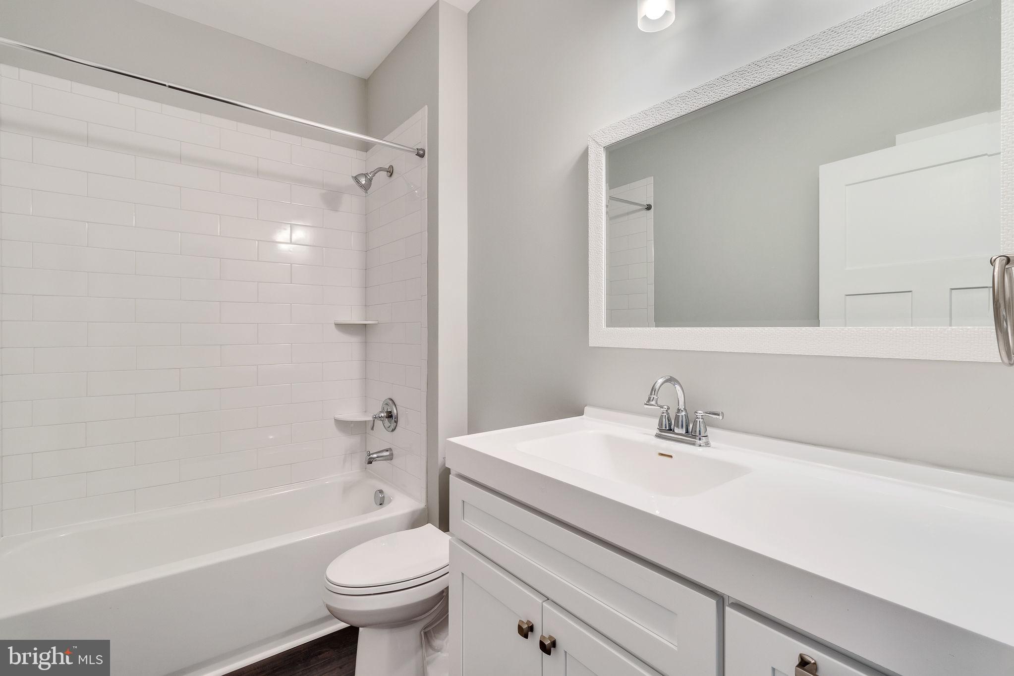 57 Waterman's Way Reedville, VA 22539 - Photo 8 of 43 One of two hall full baths, tiled tub