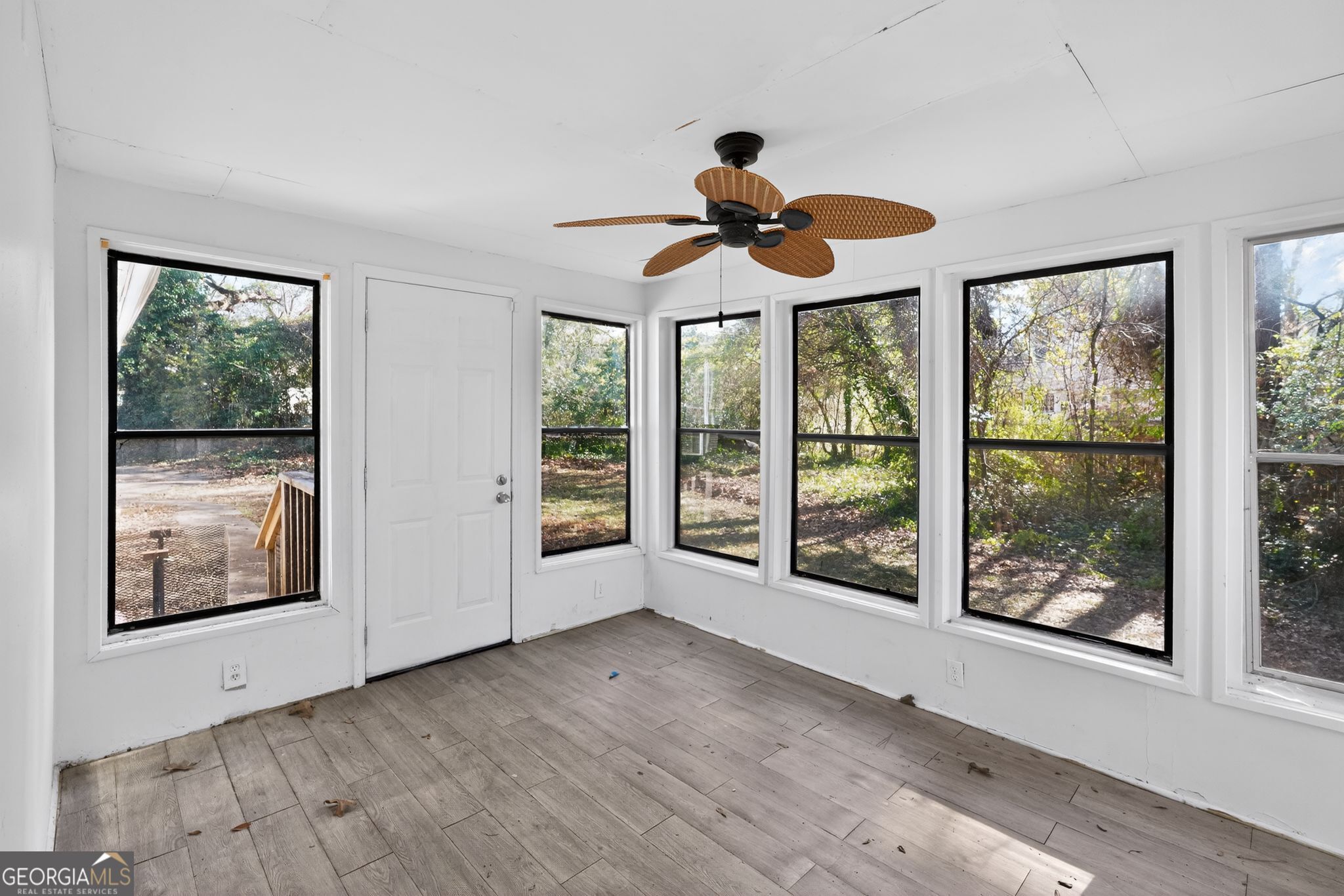 6581 Woodrow Road Lithonia, GA 30038 - Photo 26 of 34 a view of an room with wooden floor and windows