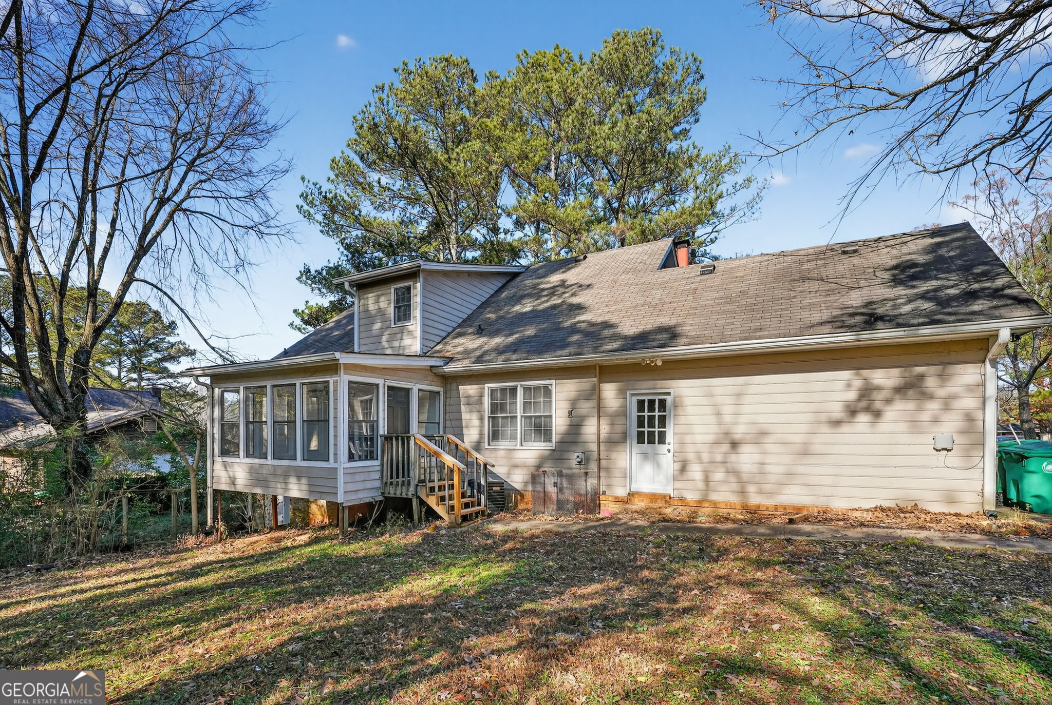 6581 Woodrow Road Lithonia, GA 30038 - Photo 29 of 34 a view of a house with a patio