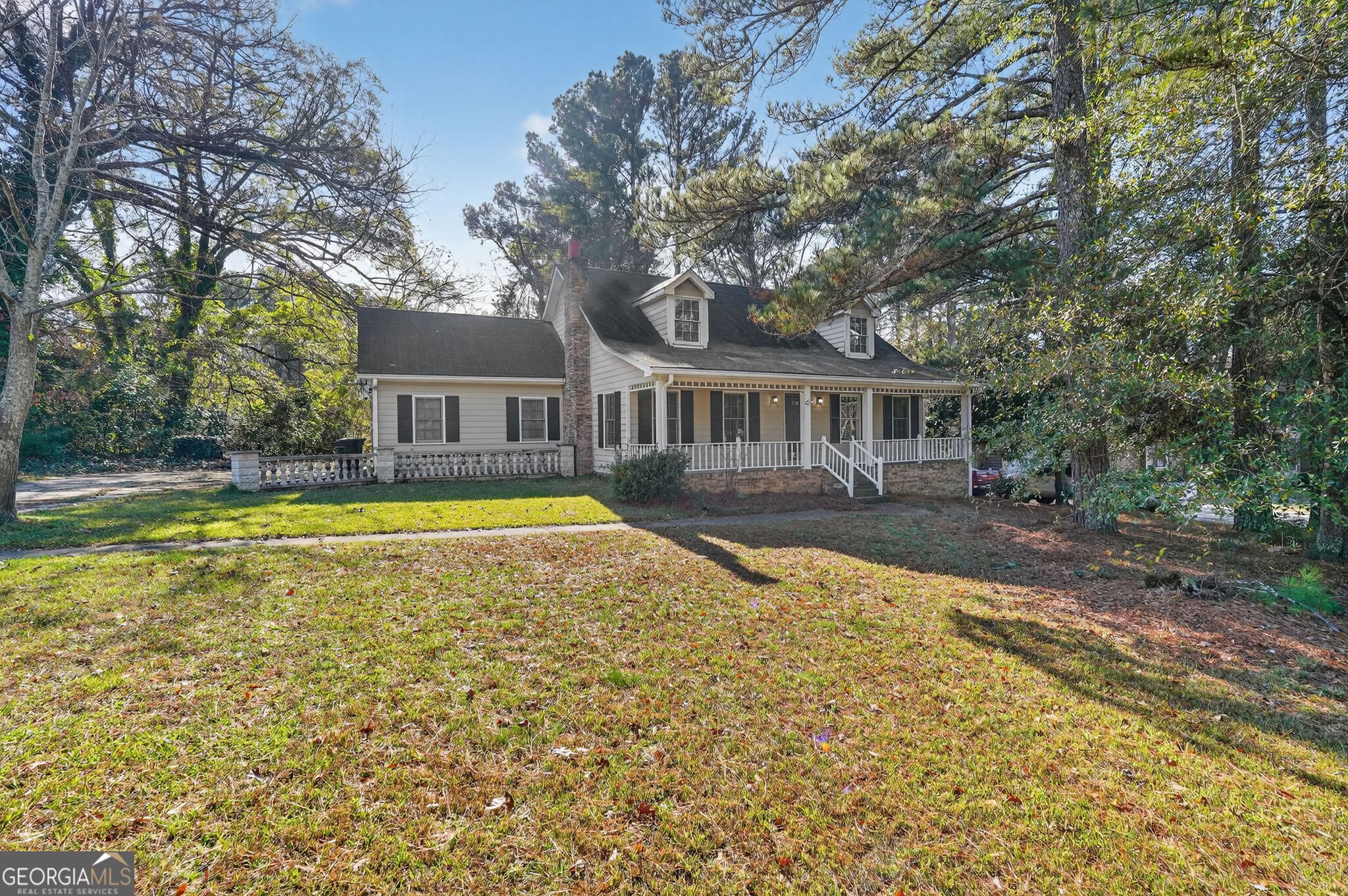 6581 Woodrow Road Lithonia, GA 30038 - Photo 3 of 34 a view of a house with swimming pool