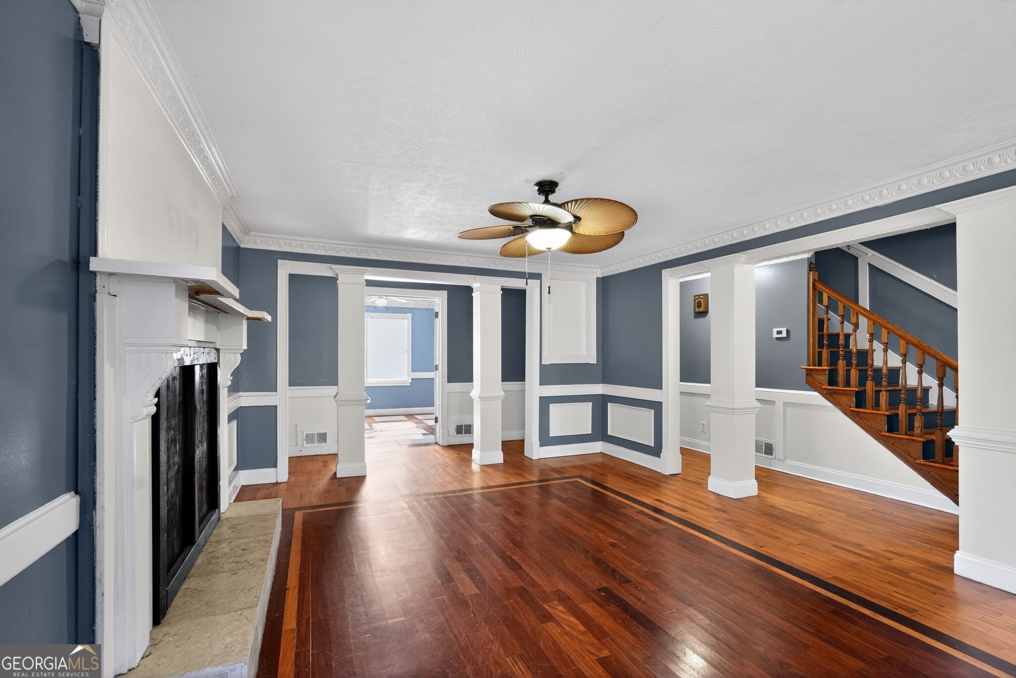 6581 Woodrow Road Lithonia, GA 30038 - Photo 6 of 34 a view of a living room and kitchen with a large window