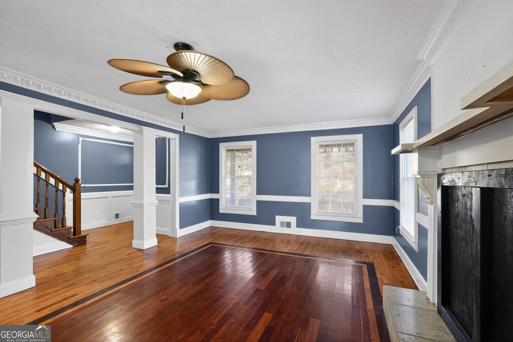 6581 Woodrow Road Lithonia, GA 30038 - Photo 7 of 34 a view of an empty room with wooden floor and a window