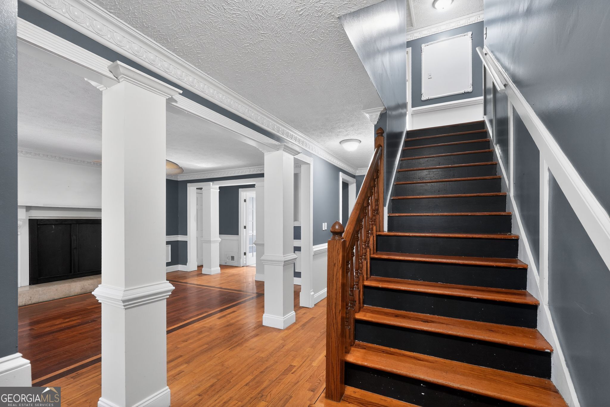 6581 Woodrow Road Lithonia, GA 30038 - Photo 8 of 34 a view of entryway and hall with wooden floor