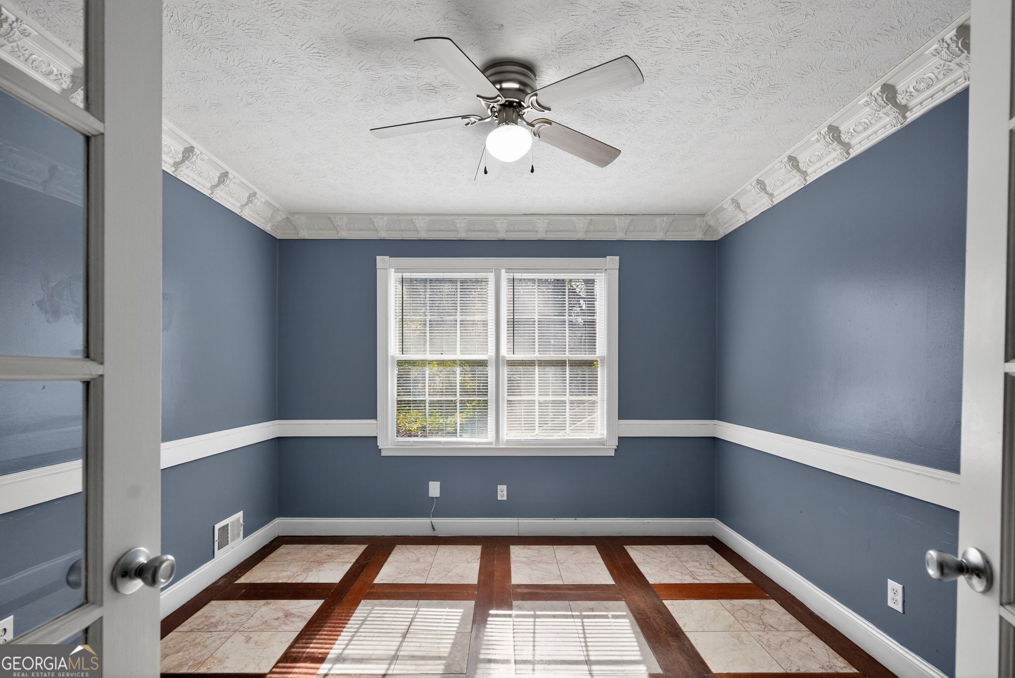 6581 Woodrow Road Lithonia, GA 30038 - Photo 10 of 34 a view of an empty room with a window