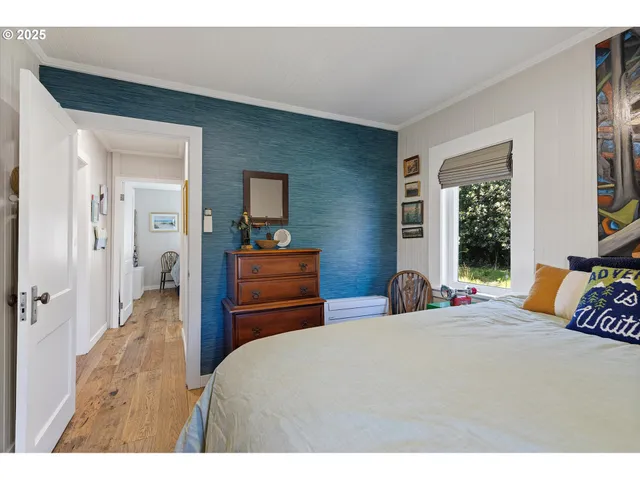 a bedroom with a bed and a dresser